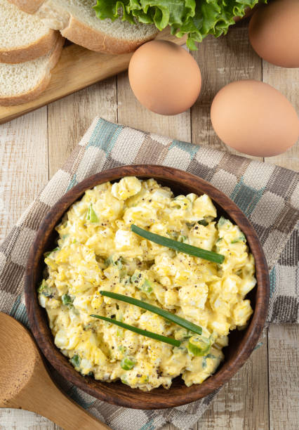 istock Bowl of egg salad on a wooden table 1388757122