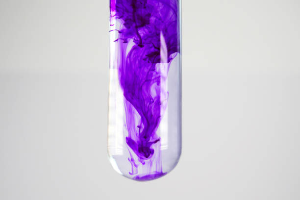 Close Up of Test Tube with purple ink. Studio shot, taken with a macro lens.