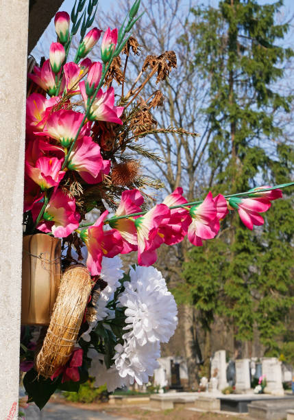 istock Artificial flowers in the public cemetery 1388760146