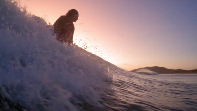 Woman Surfing into the Sunset in Costa Rica