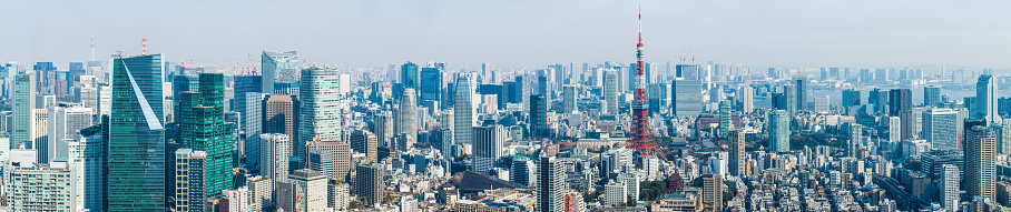 Aerial panoramic vista over the rooftops of central Tokyo, highrise housing and crowded skyscraper cityscape of Japan’s vibrant capital city.