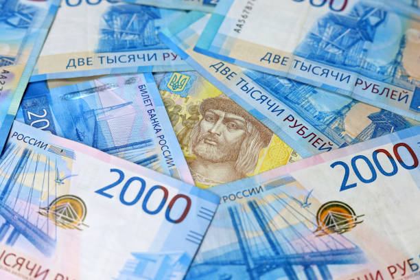 istock Ukrainian hryvnia surrounded by russian rubles 1388770156