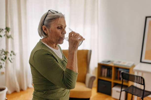 Senior woman is hydrated stock photo