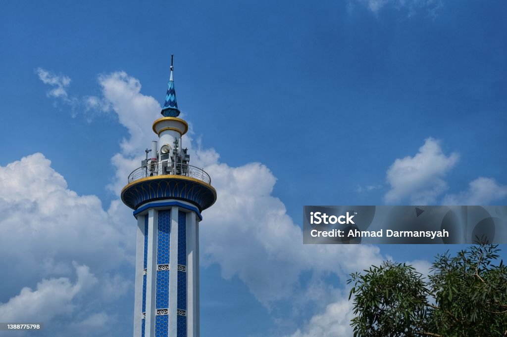 A blue minaret of msque in Madiun, East java Indonesia with clear sky Architecture Stock Photo