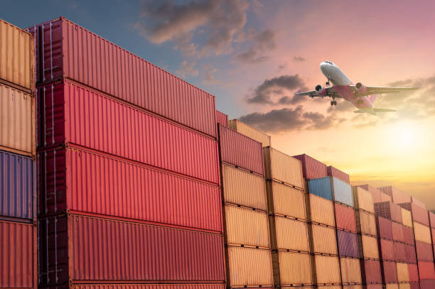 istock Industrial container yard for logistics business and transport aircraft, import, export 1388777402