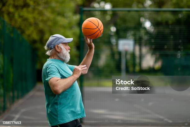Passing To A Teammate Stock Photo - Download Image Now - Basketball - Ball, Basketball - Sport, Turquoise Colored
