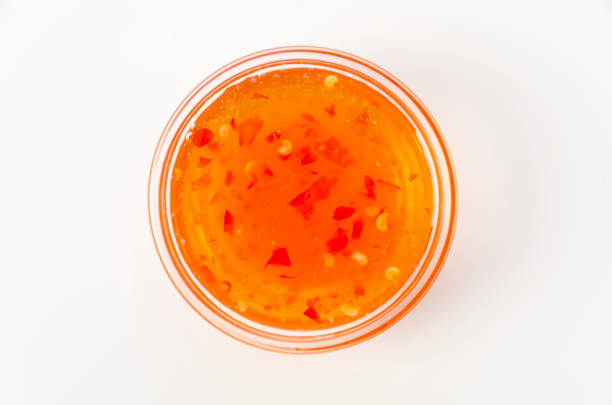 istock Sweet chili sauce on white background. 1388777811