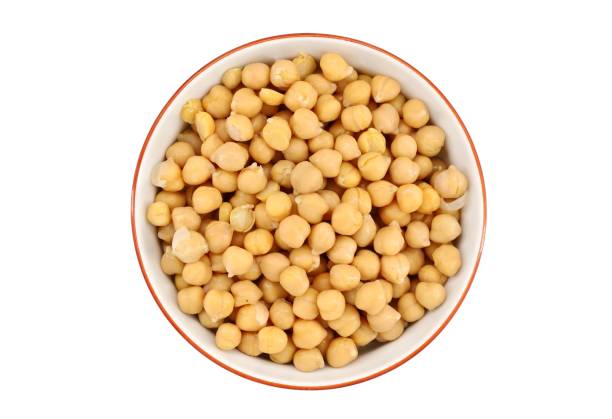 istock Boiled chickpeas in a ceramic bowl on white background. 1388780679