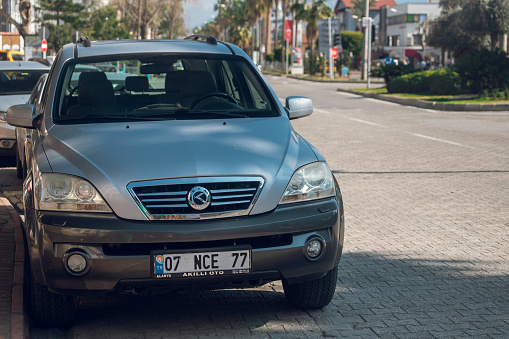 Side, Turkey -February  16, 2022:  silver Kia Sorento  is parked  on the street on a warm  autumn  day