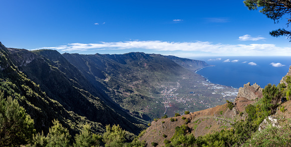El Hierro - panoramic view of El Golfo valley near Mirador de Jinama, the hiking trail with railing at the rock in the slope is Camino de Jinama