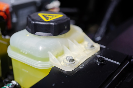 Close-up Coolant container in a car's engine