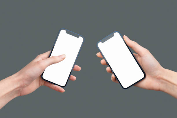 istock Hands holding phones and transfer files 1388801200