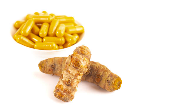istock Ground Turmeric in Capsule form Isolated on a White Background 1388802837