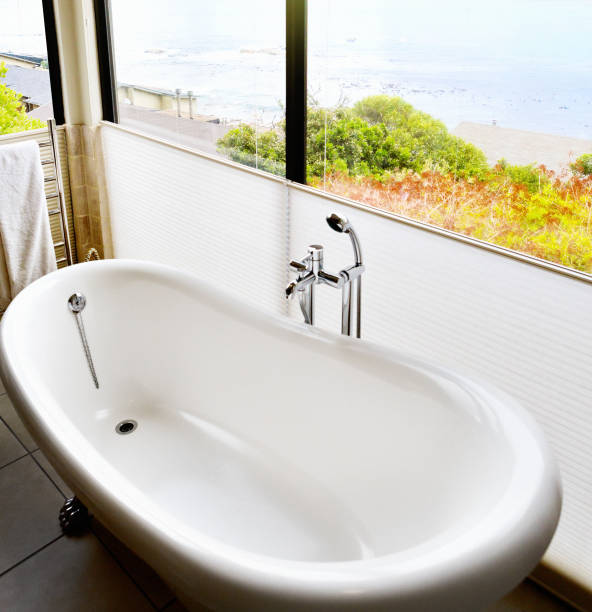istock Bath with a view: bathroom with amazing sea view 1388803115