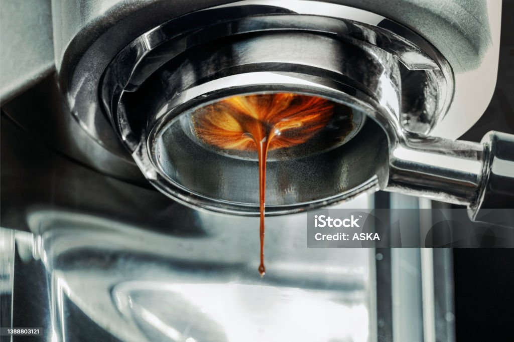 Coffee machine pouring out a cappacino Espresso Machine Pulling a Shot Espresso Stock Photo