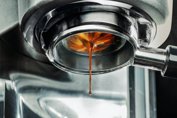 coffee machine pouring out a cappacino - pouring coffee liquid coffee bean imagens e fotografias de stock