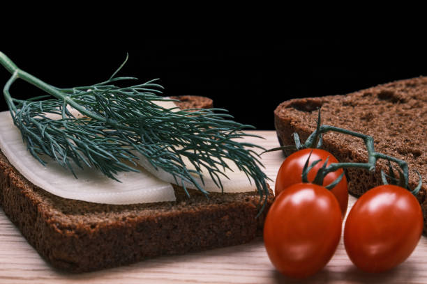 A cheese and tomato sandwich - studio shot with a white background