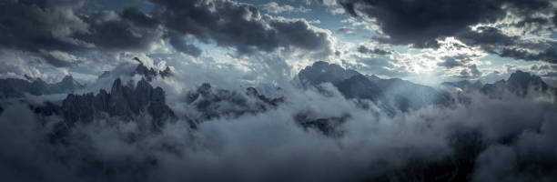 istock Mountain panorama with low clouds around mountain summits in Three Peaks Nature Reserve in the Dolomite Alps in South Tyrol 1388809297
