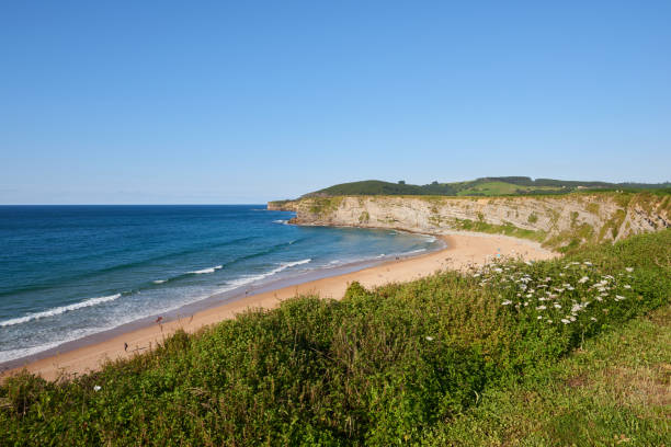 istock A beach surrounded by greenery and blue skies in northern Spain 1388810055