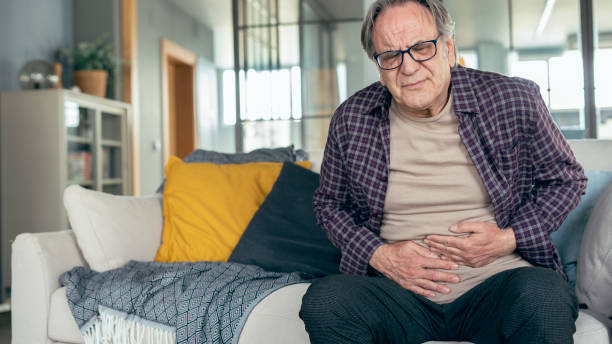 istock Senior man with stomach pain 1388810122
