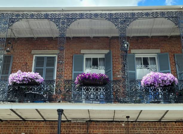 istock Wrought iron balcony with spring flowers 1388811336