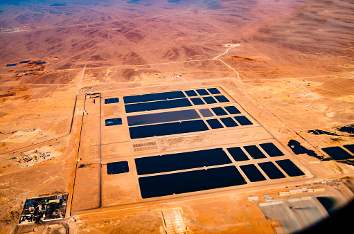 Large-scale solar farm from above. Power plants installation in desert area
