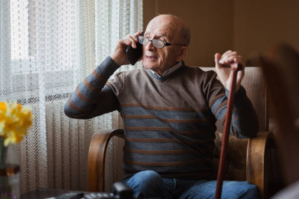 istock Happy senior with eyeglasses using mobile phone 1388819906