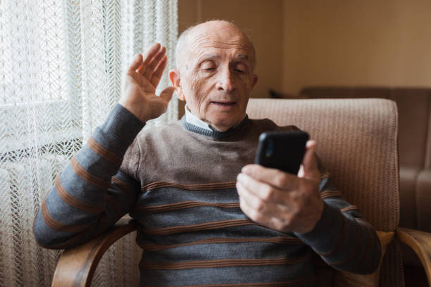 istock Senior man having a video call via smart phone 1388819933