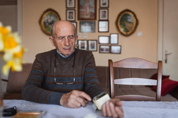 istock Man measures his own blood pressure 1388820116