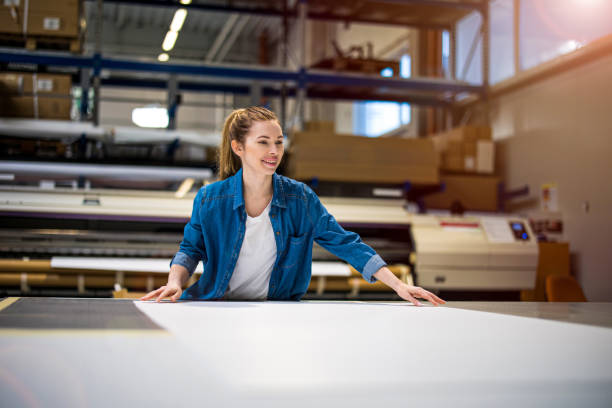 istock Woman working in printing factory 1388821110