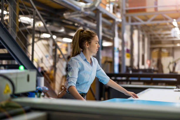 istock Woman working in printing factory 1388821840