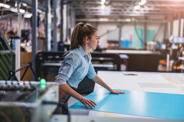istock Woman working in printing factory 1388821849