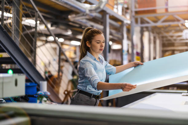 istock Woman working in printing factory 1388821851