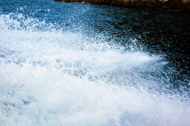 istock Splashes of water from a floating boat. 1388821871