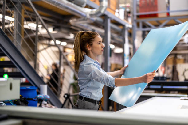 istock Woman working in printing factory 1388821873
