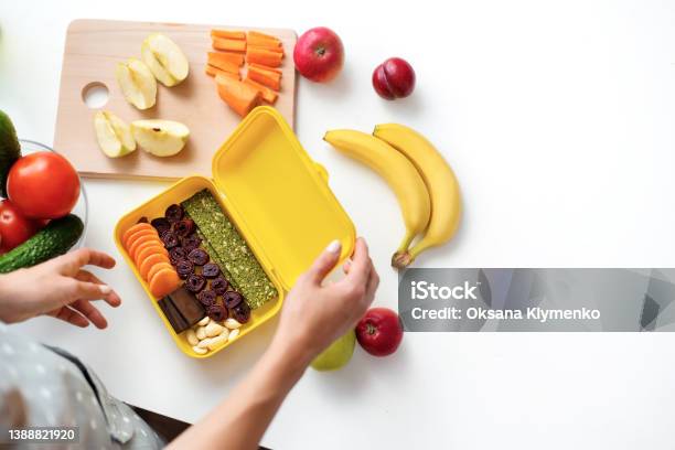 Young Woman Making School Healthy Lunch In The Morning Stock Photo - Download Image Now