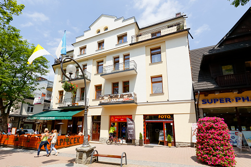 Zakopane, Poland - June 10, 2015: Cukrow House, brick house built in 1928 to 1929 by the project of F. Kotonski, located in the main shopping area and pedestrian promenade in the downtown.