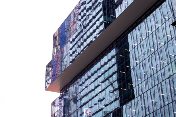 Closeup glass wall of high-rise office building with abstract reflection, background with copy space, full frame horizontal composition