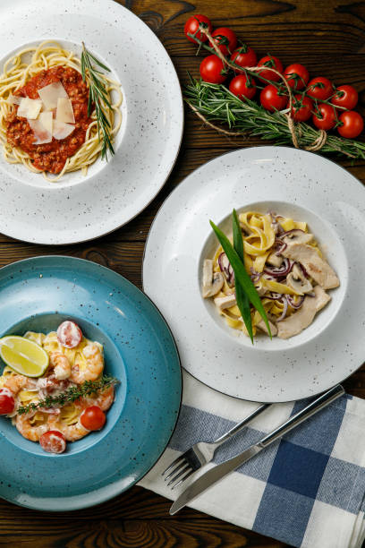istock Italian pasta on a wooden table 1388824102