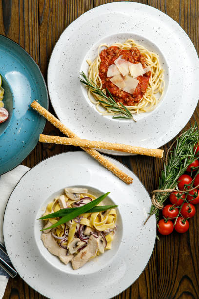 istock Italian pasta on a wooden table 1388824125