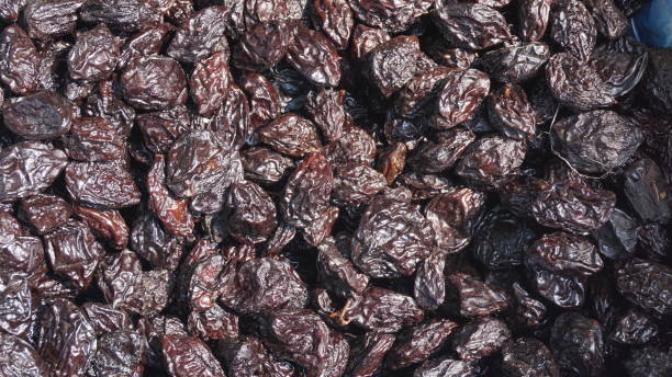 istock dried dark brown and black grapes 1388824175