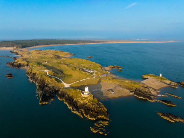 Sunset aerial view of Twr Mawr Lighthouse on Ynys Llanddwyn island, Anglesey, Wales stock photo