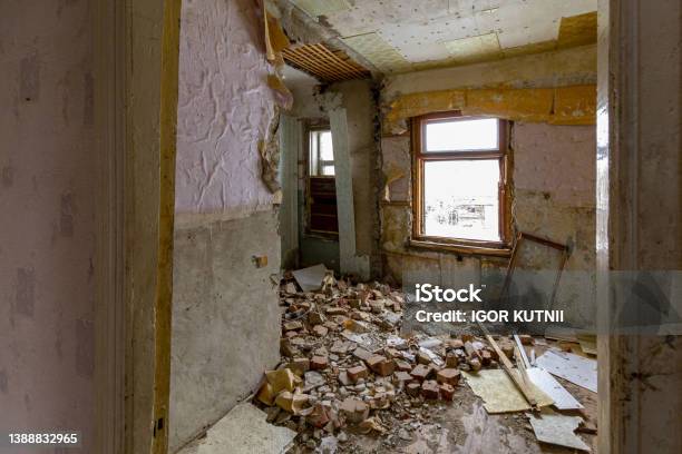 Many Bricks Fell From A Hole In The Wall Of The House Destroyed By An Explosion Residential Apartment Building Stock Photo - Download Image Now