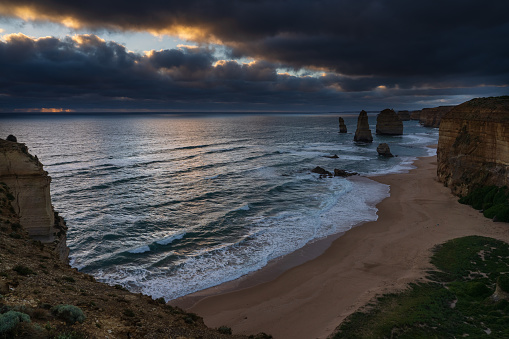 Moody sky over the Twelve Apostles at dusk, Great Ocean Road, Victoria, Australia