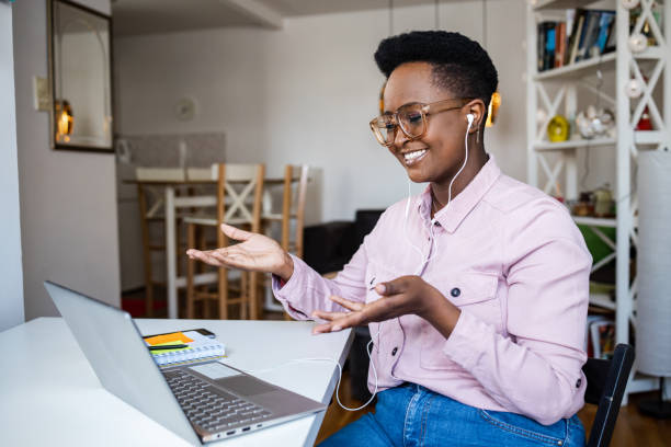 istock Young woman at home, talking on a video call 1388836415
