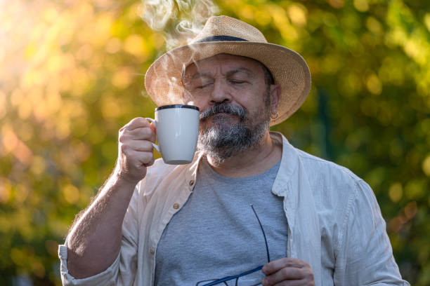 istock Senior Man Drinking a Coffee or a Tea Outdoors. 1388837554