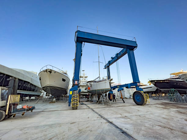 istock Vessel lifting crane placing boat on blocks 1388845399