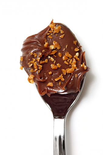 spoon with chocolate filling, dulce de leche and caramel from chocolate eggs for Brazilian Easter