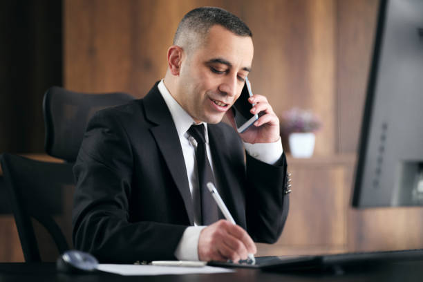Businessman Having A Phone Call In The Office stock photo