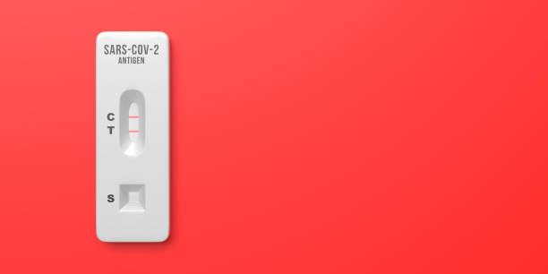 istock Rapid Test Positive Coronavirus Result Device on red background, copy space 1388857382